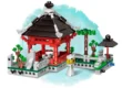Set de bloques de construcción de un templo oriental con tejado negro y detalles rojos, ideal para crear mundos en miniatura.